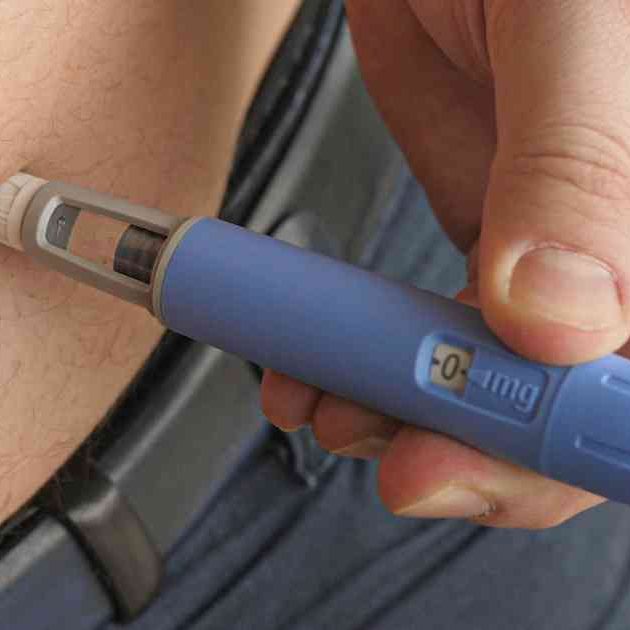 person using weight loss injection
