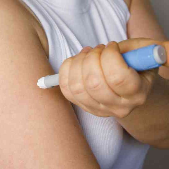 person injecting weight loss injection