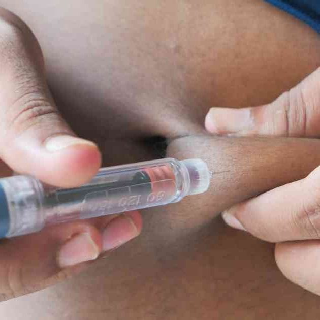 person using weight loss injection