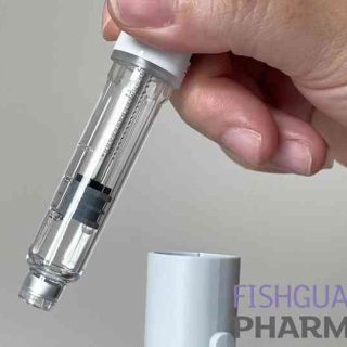 person removing weight loss injection from cap