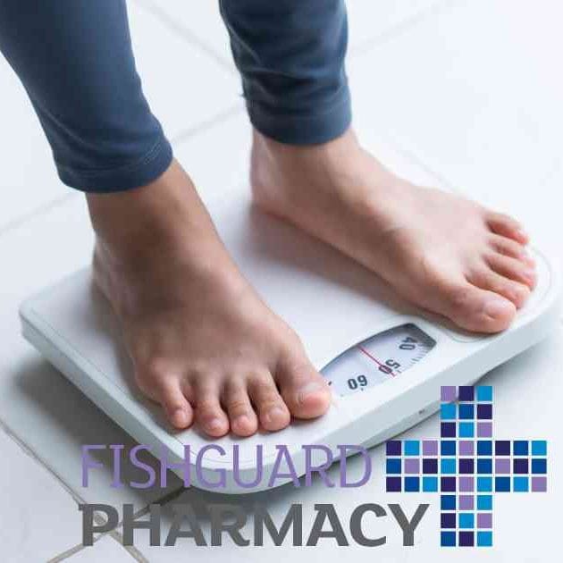 person in bare feet standing on scales